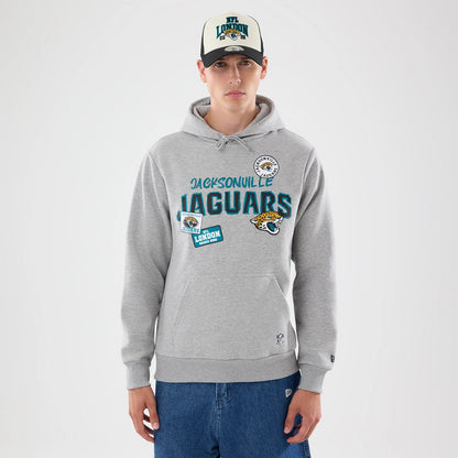 The model is wearing this NFL Patch Jacksonville Jaguars Pullover Hoodie in grey. 1