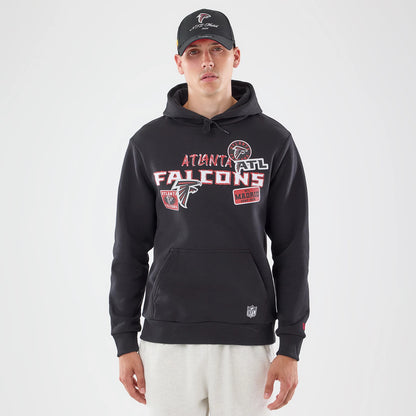The model is wearing this NFL Patch Atlanta Falcons Pullover Hoodie in black. 1