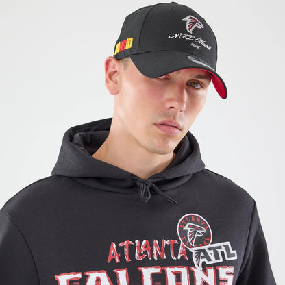 The model is wearing this NFL Patch Atlanta Falcons Pullover Hoodie in black. 6