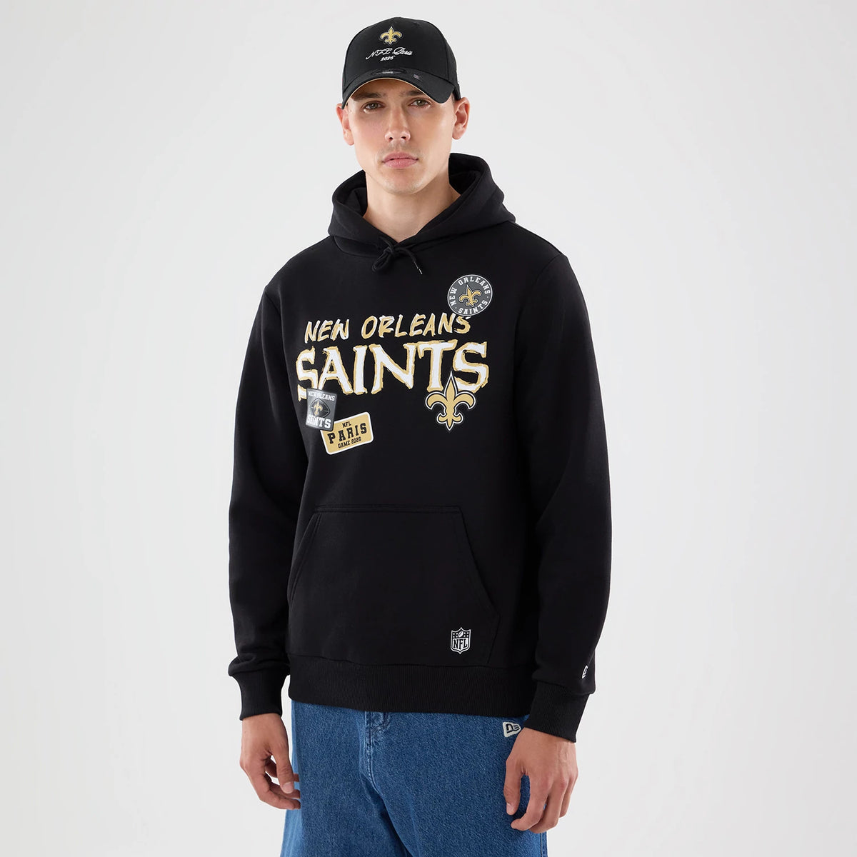 The model is wearing this NFL Patch New Orleans Saints Pullover Hoodie in black. 1
