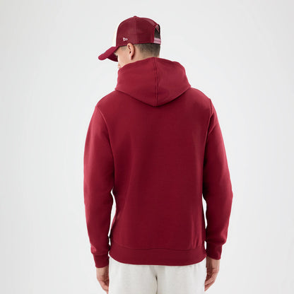 The model is wearing this NFL Patch Washington Commanders Pullover Hoodie in dark red. 2