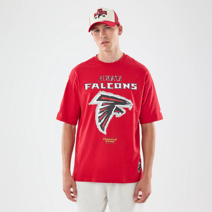 The model is wearing this NFL Graphic Slogan Atlanta Falcons Oversized T-Shirt in red. 1