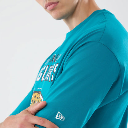 New Era Jacksonville Jaguars NFL Graphic Slogan Turquoise Oversized T-Shirt, on-model view highlighting the turquoise fabric, white embroidered New Era logo on the sleeve, and view of the graphic slogan and jaguar image across the chest.