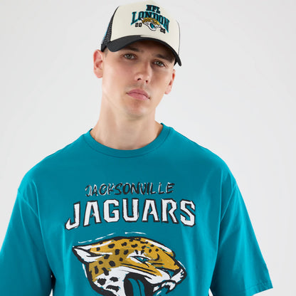 The model is wearing this NFL Graphic Slogan Jacksonville Jaguars Oversized T-Shirt in turquoise. 6