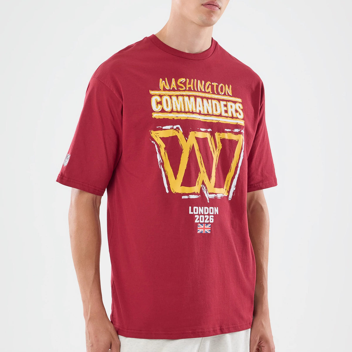 The model is wearing this NFL Graphic Slogan Washington Commanders Oversized T-Shirt in dark red. 3