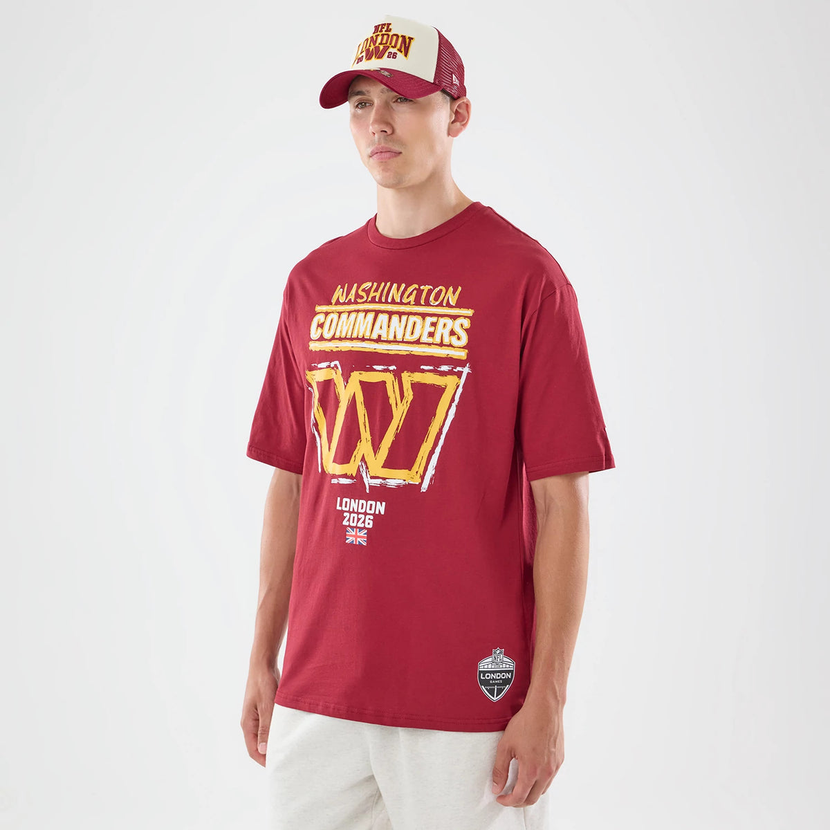 The model is wearing this NFL Graphic Slogan Washington Commanders Oversized T-Shirt in dark red. 1