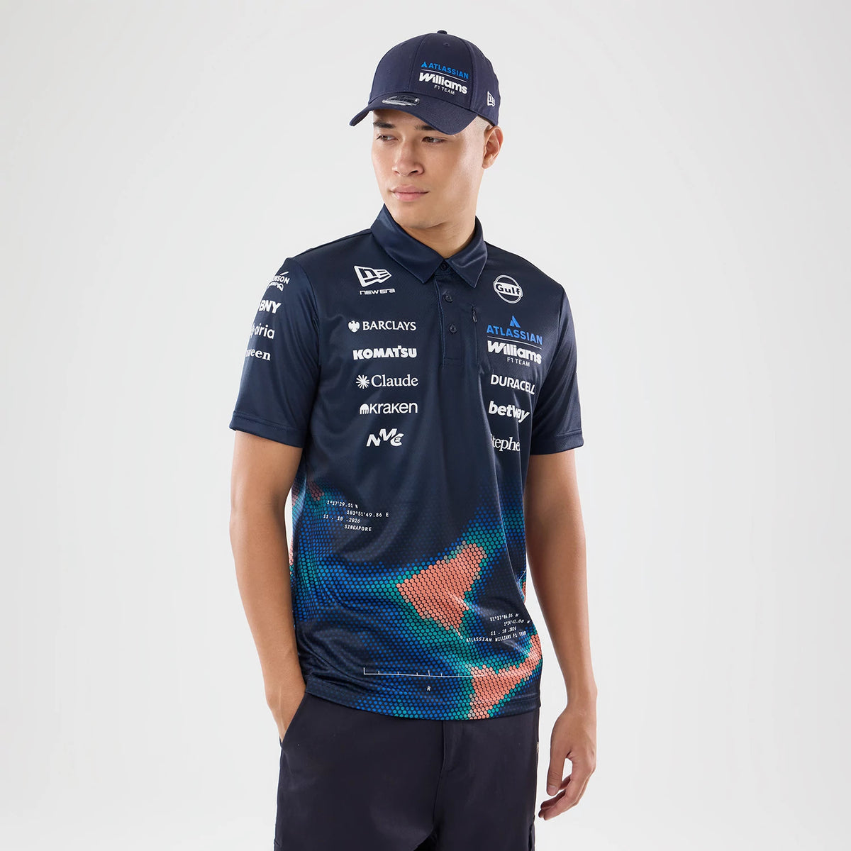The model is wearing this Singapore Williams Tech Polo T-Shirt in navy. 1