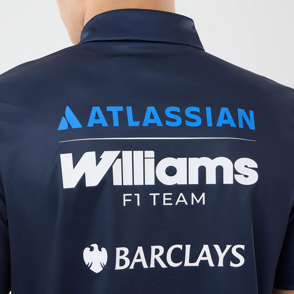 The model is wearing this Singapore Williams Tech Polo T-Shirt in navy. 6