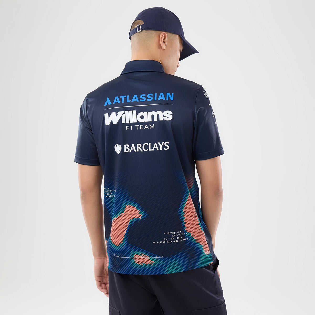 The model is wearing this Singapore Williams Tech Polo T-Shirt in navy. 2