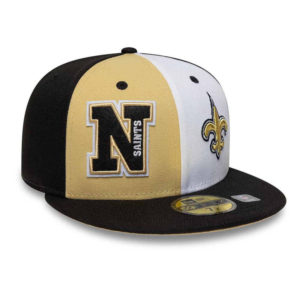 Saints NFL International Games Black New Era 59FIFTY Fitted Cap, front view showing a black and gold embroidered N on the left front panel, a team logo on the right, and a contrasting black flat visor with a gold 59FIFTY size sticker.