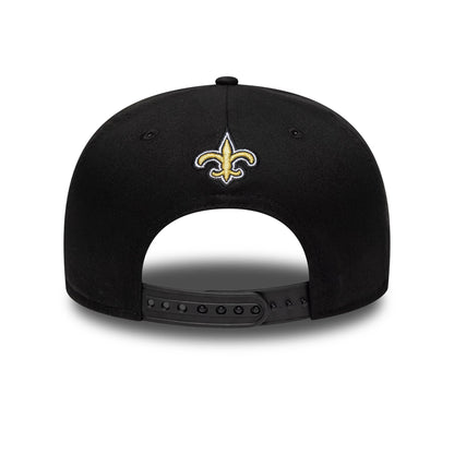 New Orleans Saints NFL International Games 2026 Paris Black New Era 19TWENTY Adjustable Cap, rear view showing the gold Fleur-de-lis logo embroidered at the centre of the back panels, with a black adjustable strap and black eyelets on the crown.