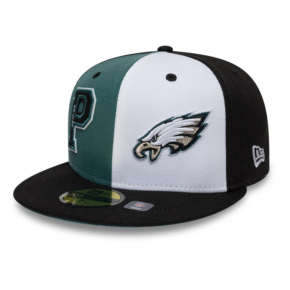 Eagles NFL International Games Black New Era 59FIFTY Fitted Cap, three-quarter view showing a black and white split panel design with an embroidered eagle logo on the front, a raised letter P on the left.