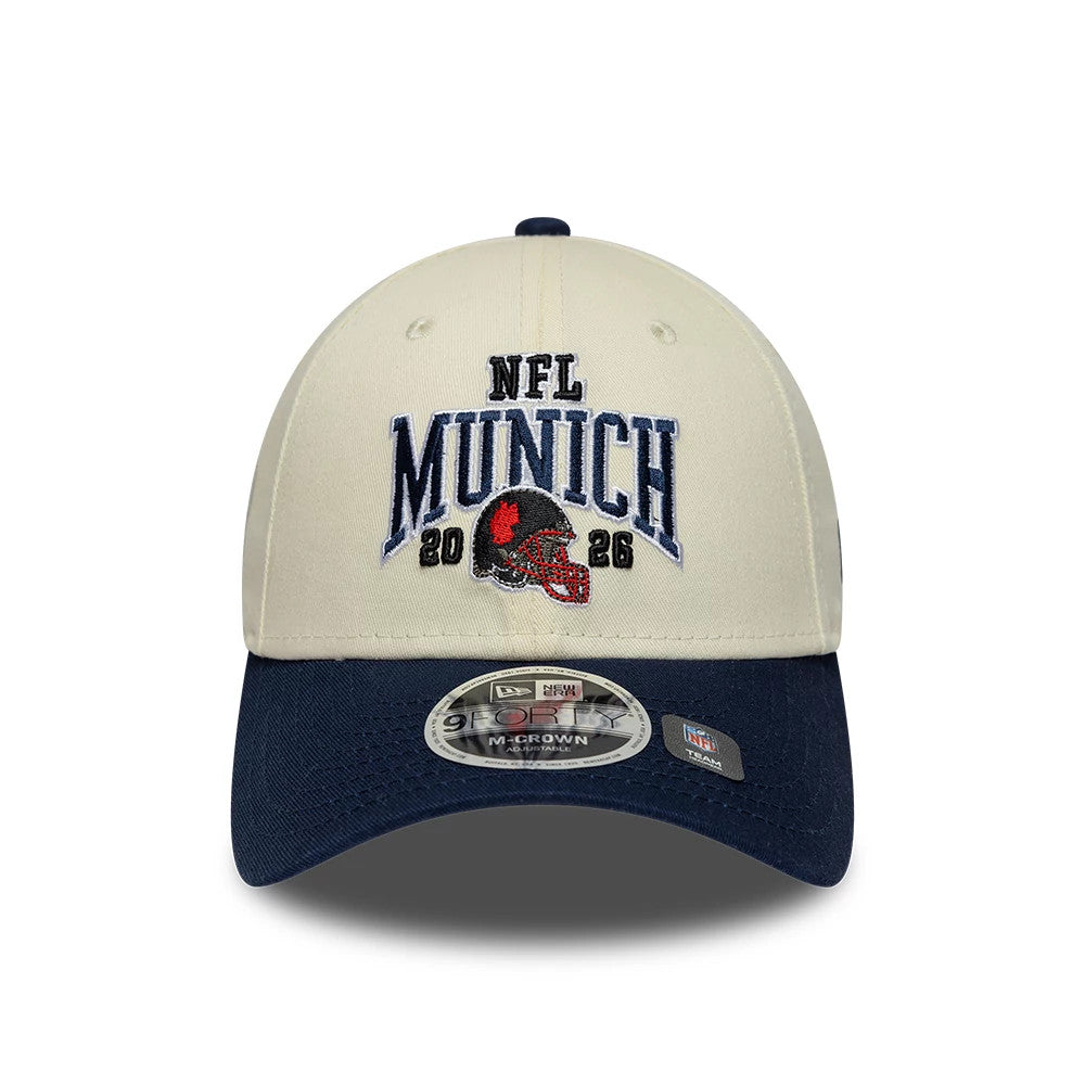 Pictured is this NFL International Series Games 2026 Munich New England Patriots 9FORTY M-Crown cap in white & dark blue. 2
