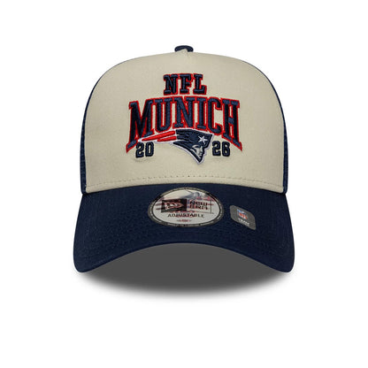 Pictured is this NFL International Games 2026 Munich New England Patriots 9FORTY A-Frame Trucker cap in dark blue. 2