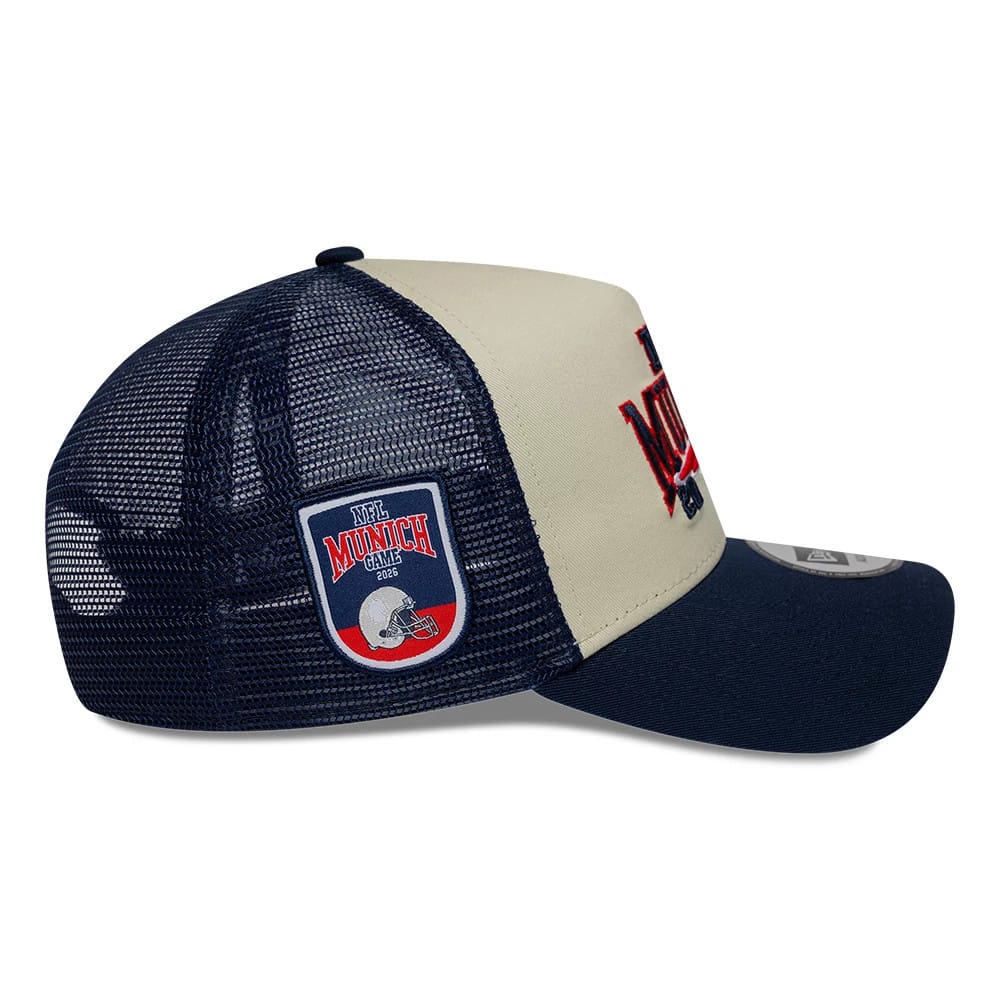 Pictured is this NFL International Series Games 2026 Munich New England Patriots 9FORTY A-Frame Trucker cap in dark blue. 6