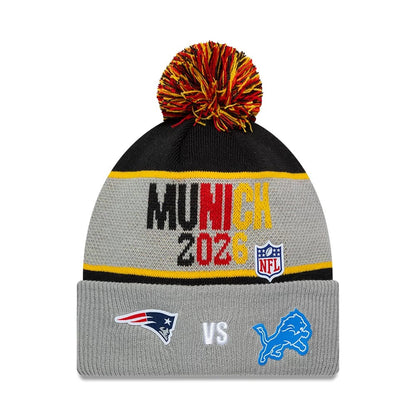 Pictured is this NFL International Series Games 2026 Munich New England Patriots VS Detroit Lions Dueling Logos Cuff Knit Beanie hat in grey. 1