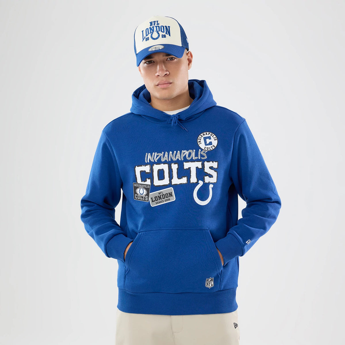 The model is wearing this NFL International Games 2026 Indianapolis Colts Pullover Hoodie in blue. 1