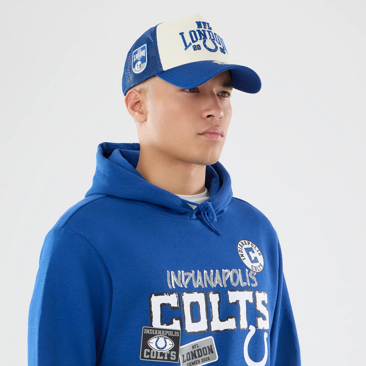 The model is wearing this NFL International Games 2026 Indianapolis Colts Pullover Hoodie in blue. 6