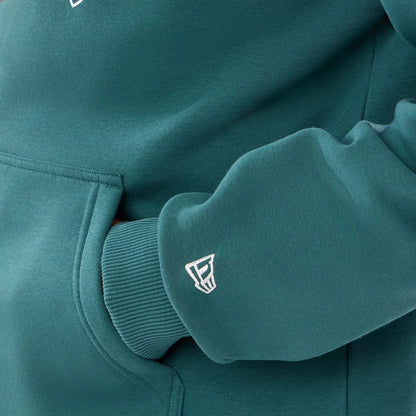 The model is wearing this NFL International Games 2026 Philadelphia Eagles Pullover Hoodie in dark green. 5