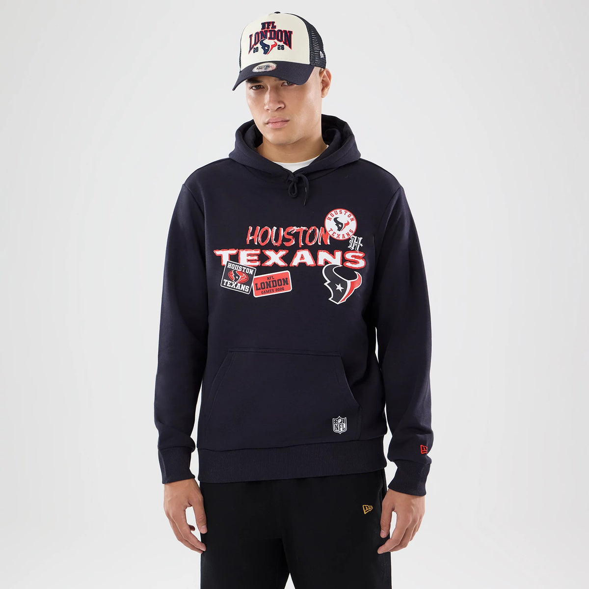 The model is wearing this NFL International Games 2026 Houston Texans Pullover Hoodie in navy. 1