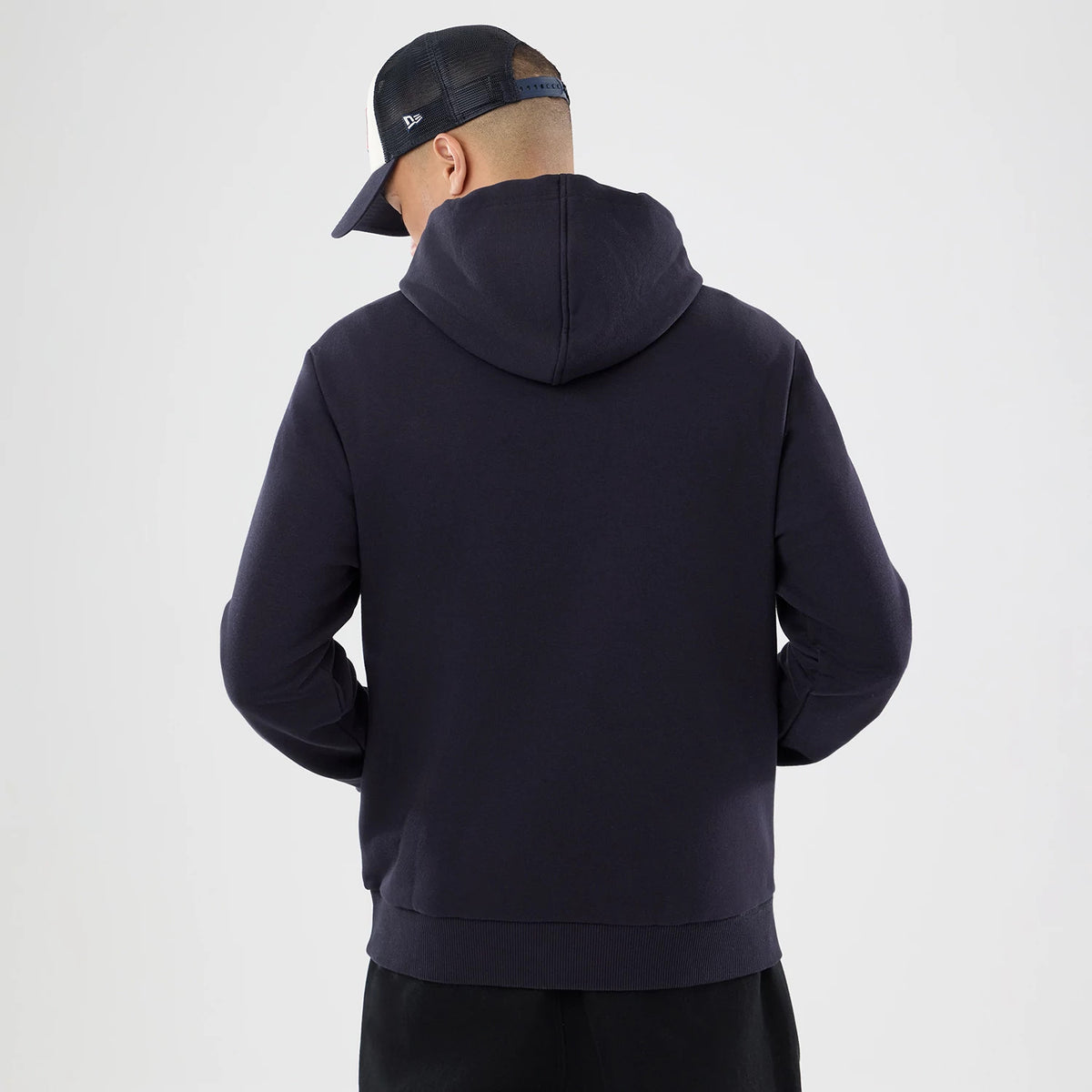 The model is wearing this NFL International Games 2026 Houston Texans Pullover Hoodie in navy. 2