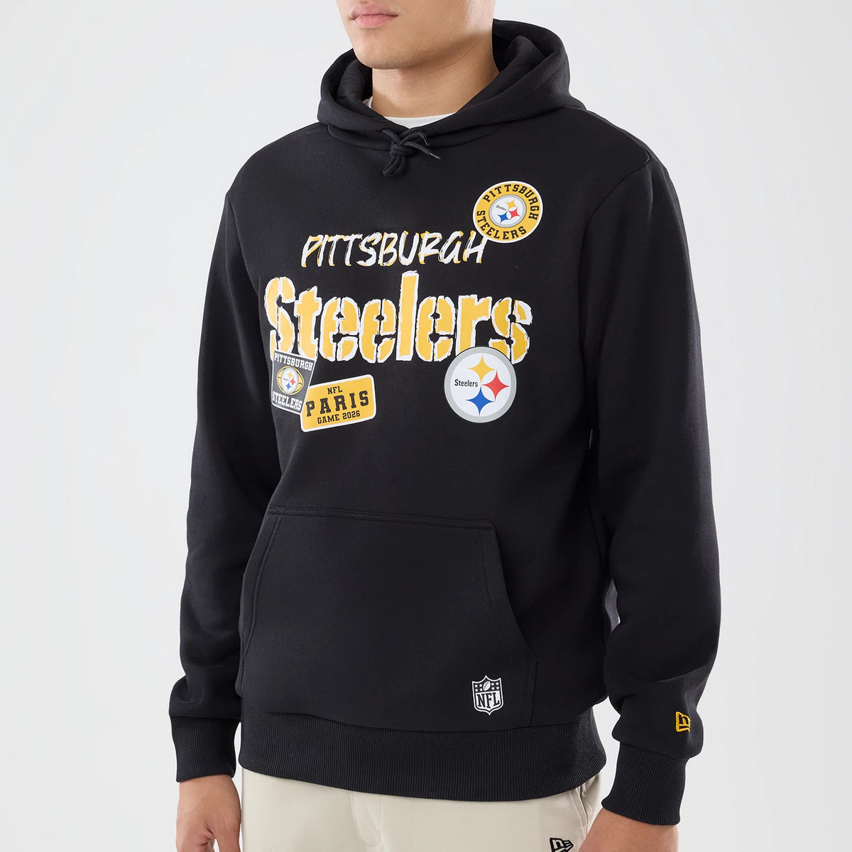 The model is wearing this NFL International Games 2026 Pittsburgh Steelers Pullover Hoodie in black. 3