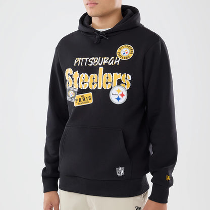 The model is wearing this NFL International Games 2026 Pittsburgh Steelers Pullover Hoodie in black. 3