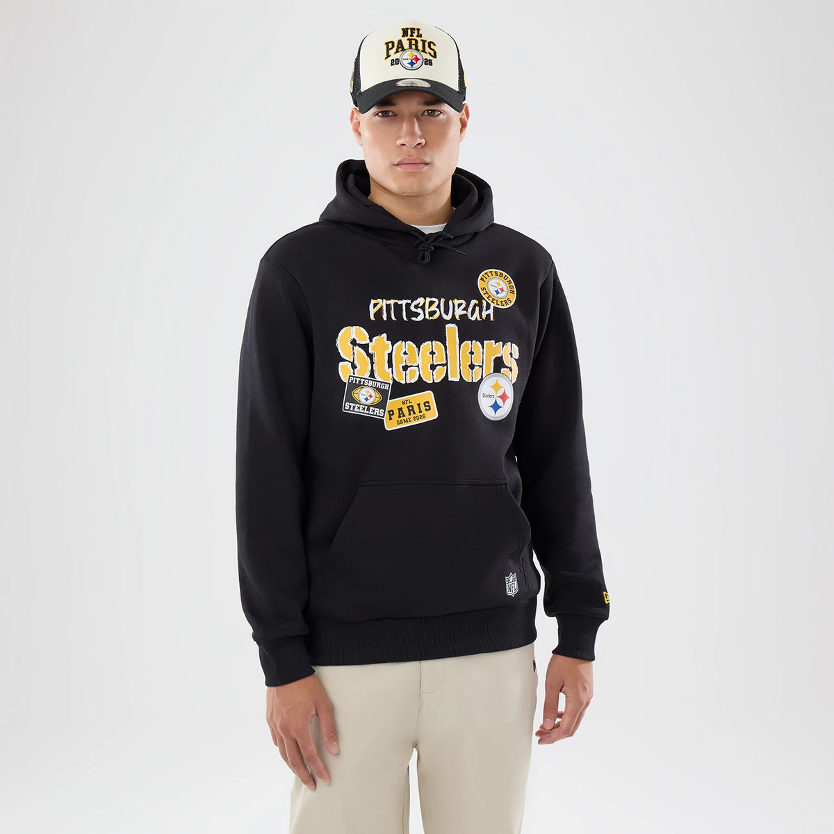 The model is wearing this NFL International Games 2026 Pittsburgh Steelers Pullover Hoodie in black. 1