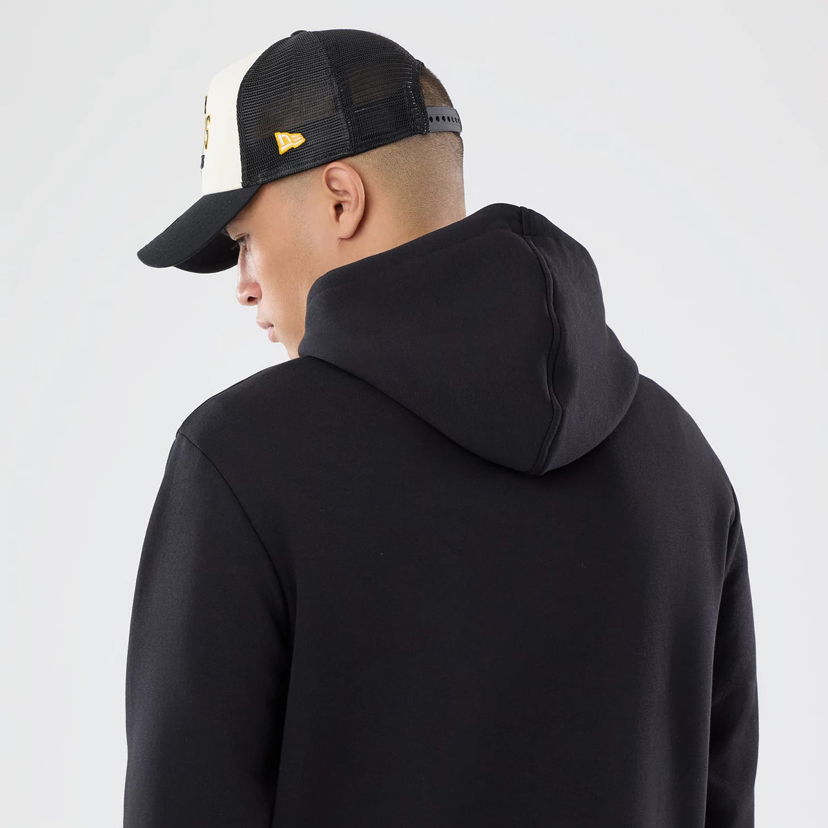The model is wearing this NFL International Games 2026 Pittsburgh Steelers Pullover Hoodie in black. 7