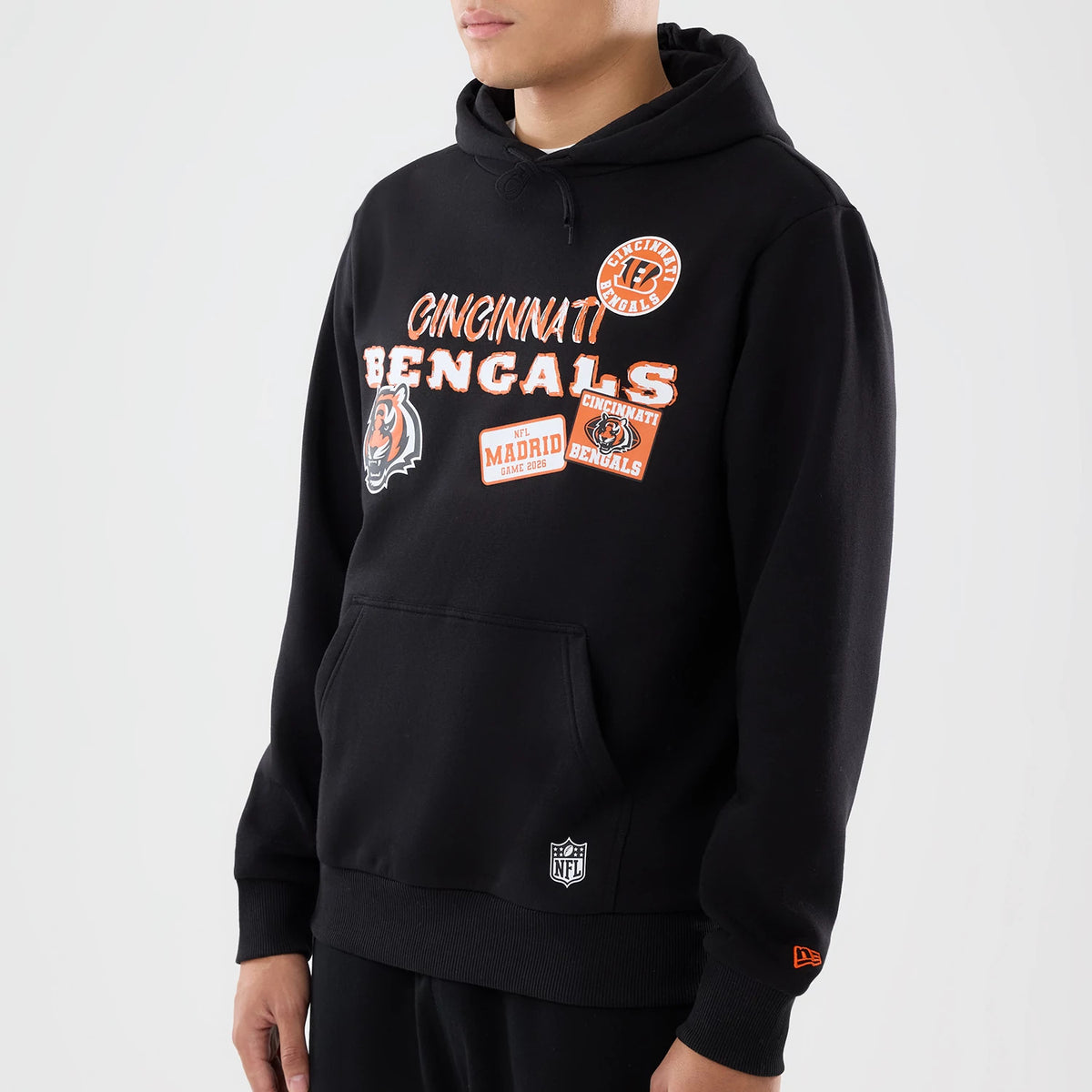 The model is wearing this NFL International Games 2026 Cincinnati Bengals Pullover Hoodie in black. 3