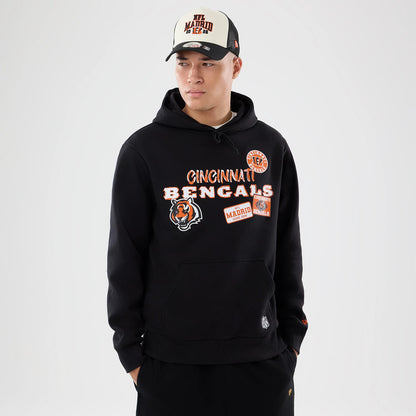 The model is wearing this NFL International Games 2026 Cincinnati Bengals Pullover Hoodie in black. 1