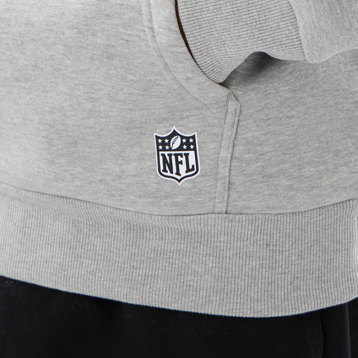 The model is wearing this NFL International Games 2026 New England Patriots Pullover Hoodie in grey. 4