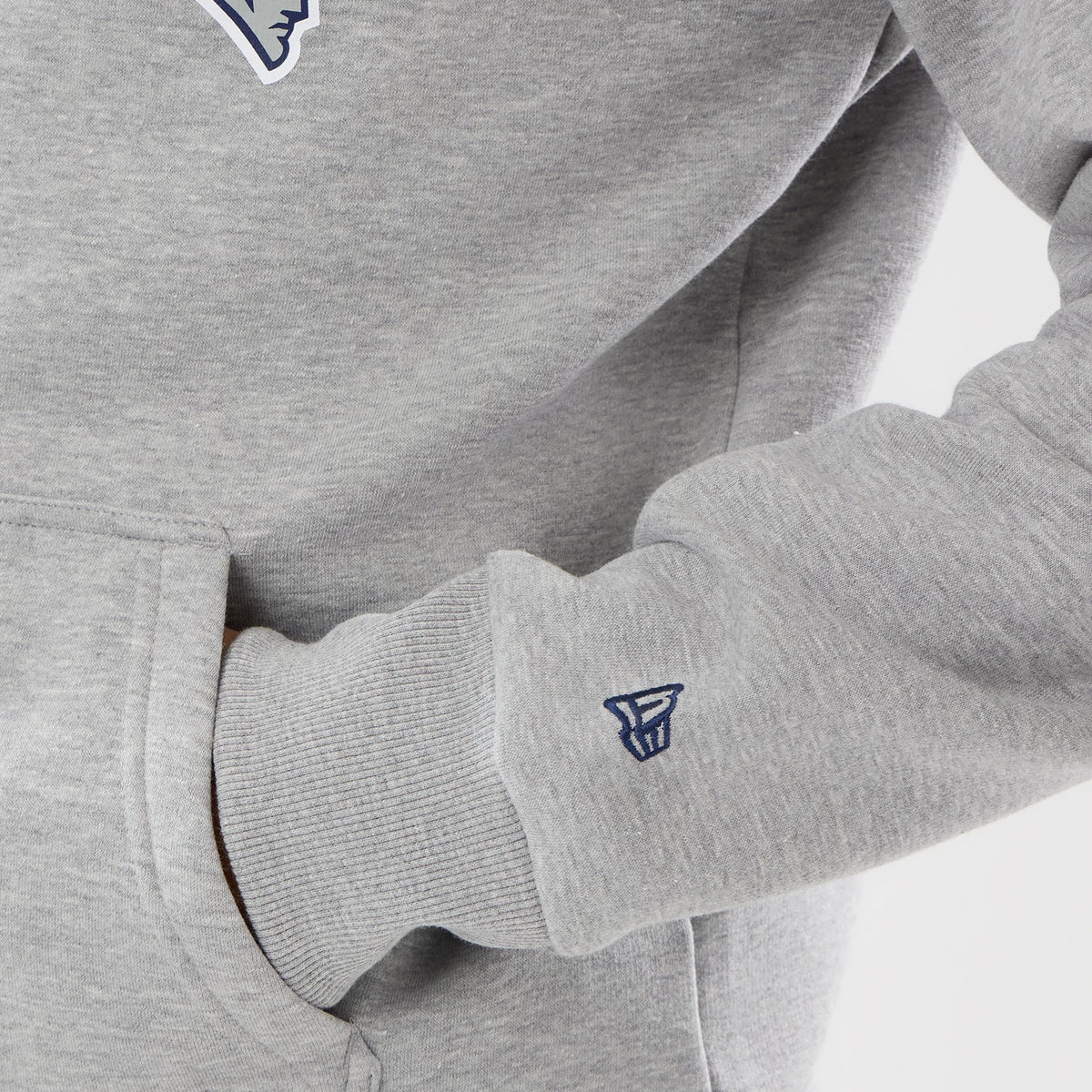 The model is wearing this NFL International Games 2026 New England Patriots Pullover Hoodie in grey. 5