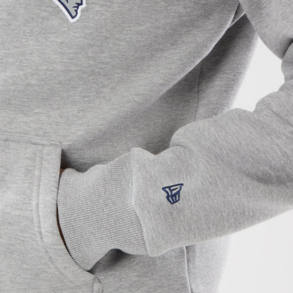 The model is wearing this NFL International Games 2026 New England Patriots Pullover Hoodie in grey. 5