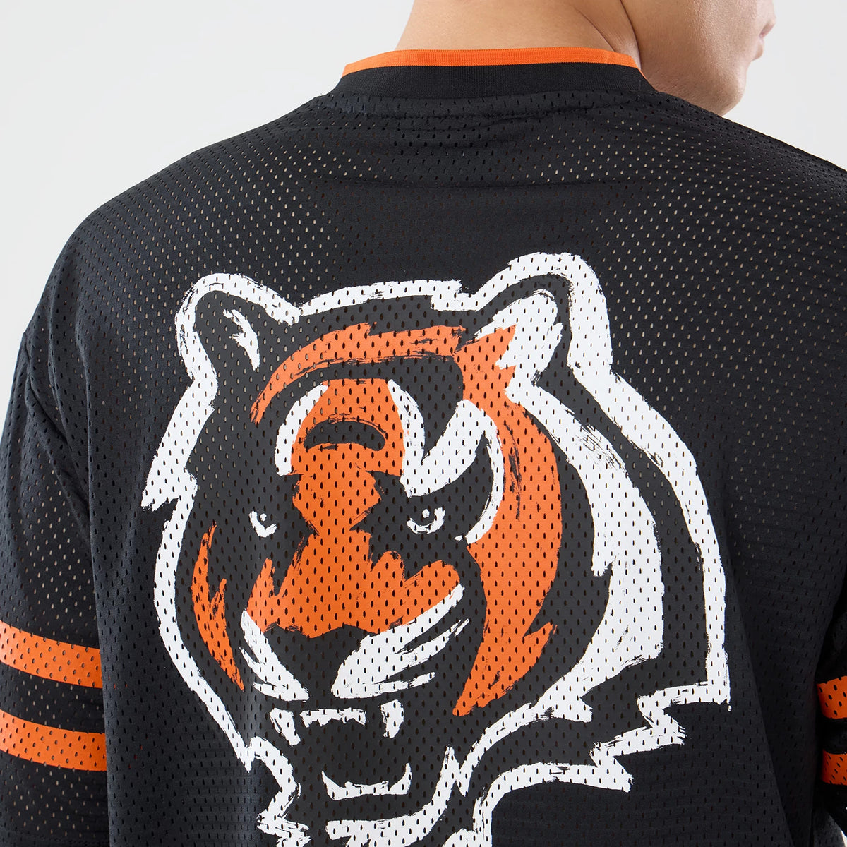 The model is wearing this NFL International Games 2026 Cincinnati Bengals Mesh Jersey in black. 7