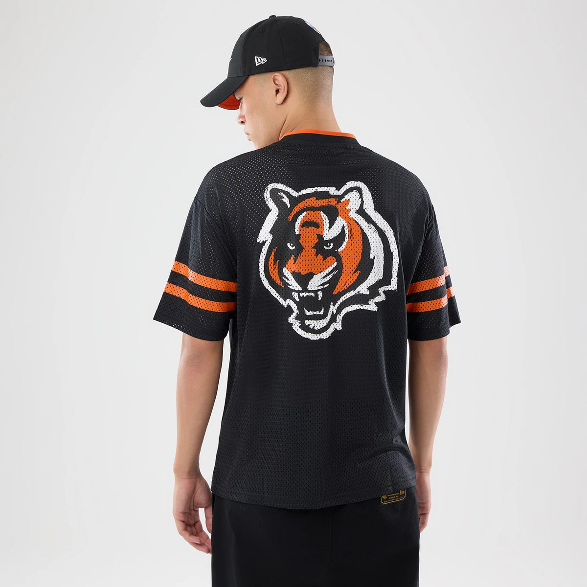 The model is wearing this NFL International Games 2026 Cincinnati Bengals Mesh Jersey in black. 2