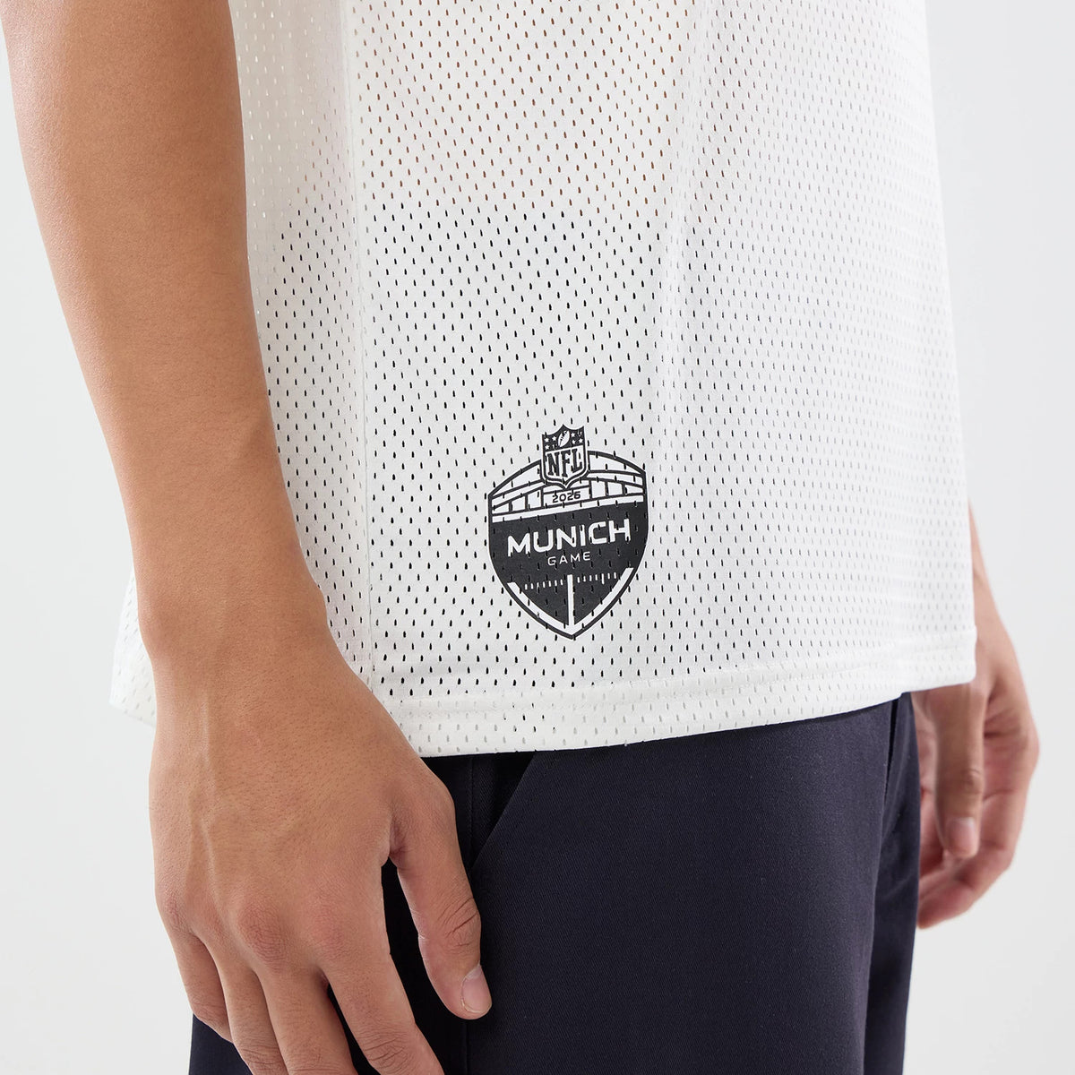 The model is wearing this NFL International Series Games 2026 New England Patriots Mesh Jersey in white. 4