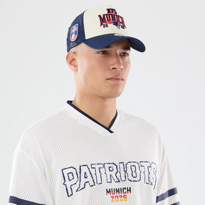 The model is wearing this NFL International Series Games 2026 New England Patriots Mesh Jersey in white. 6