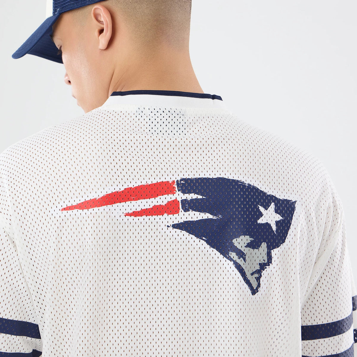 The model is wearing this NFL International Games 2026 New England Patriots Mesh Jersey in white. 7