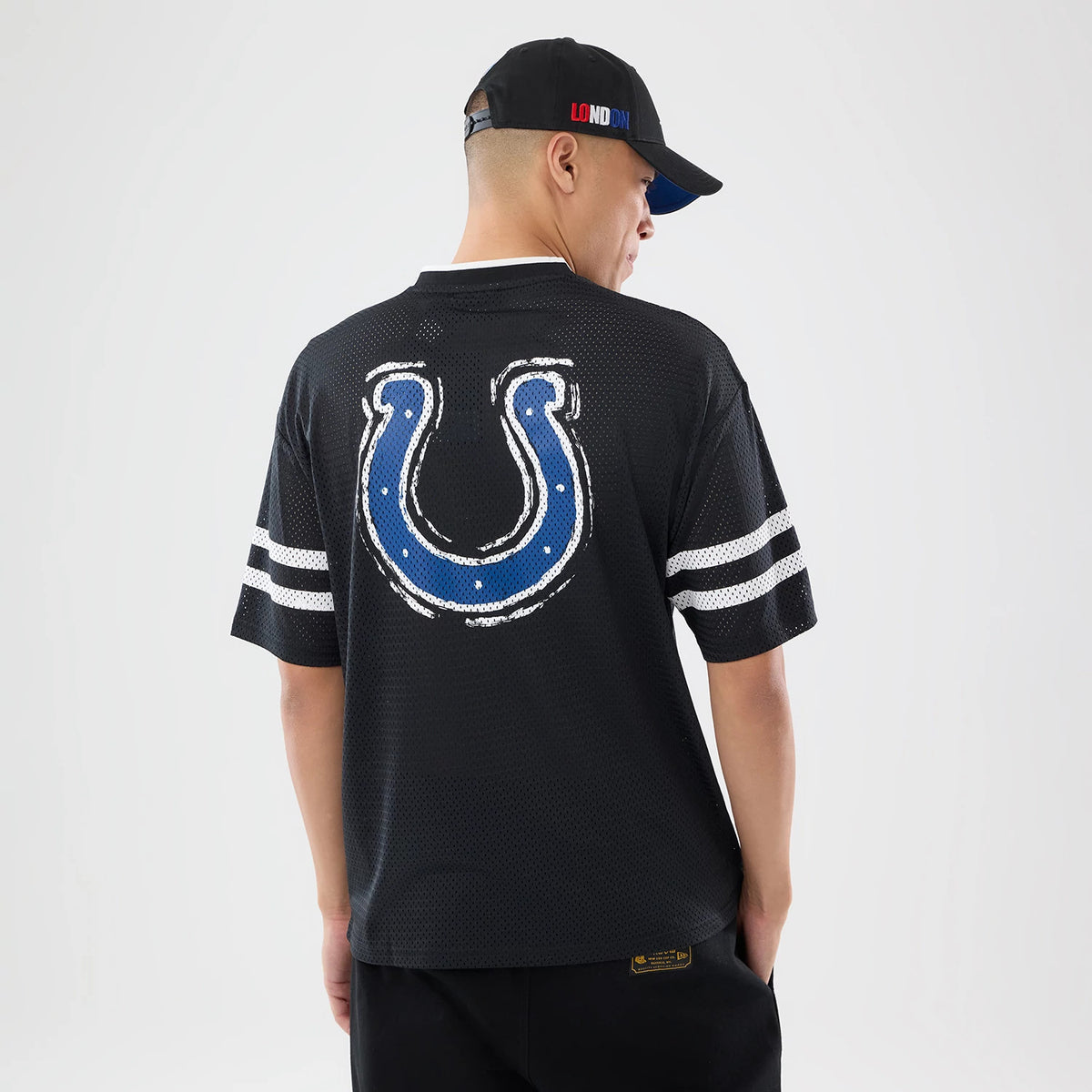 The model is wearing this NFL International Series Games 2026 Indianapolis Colts Mesh Jersey in black. 2
