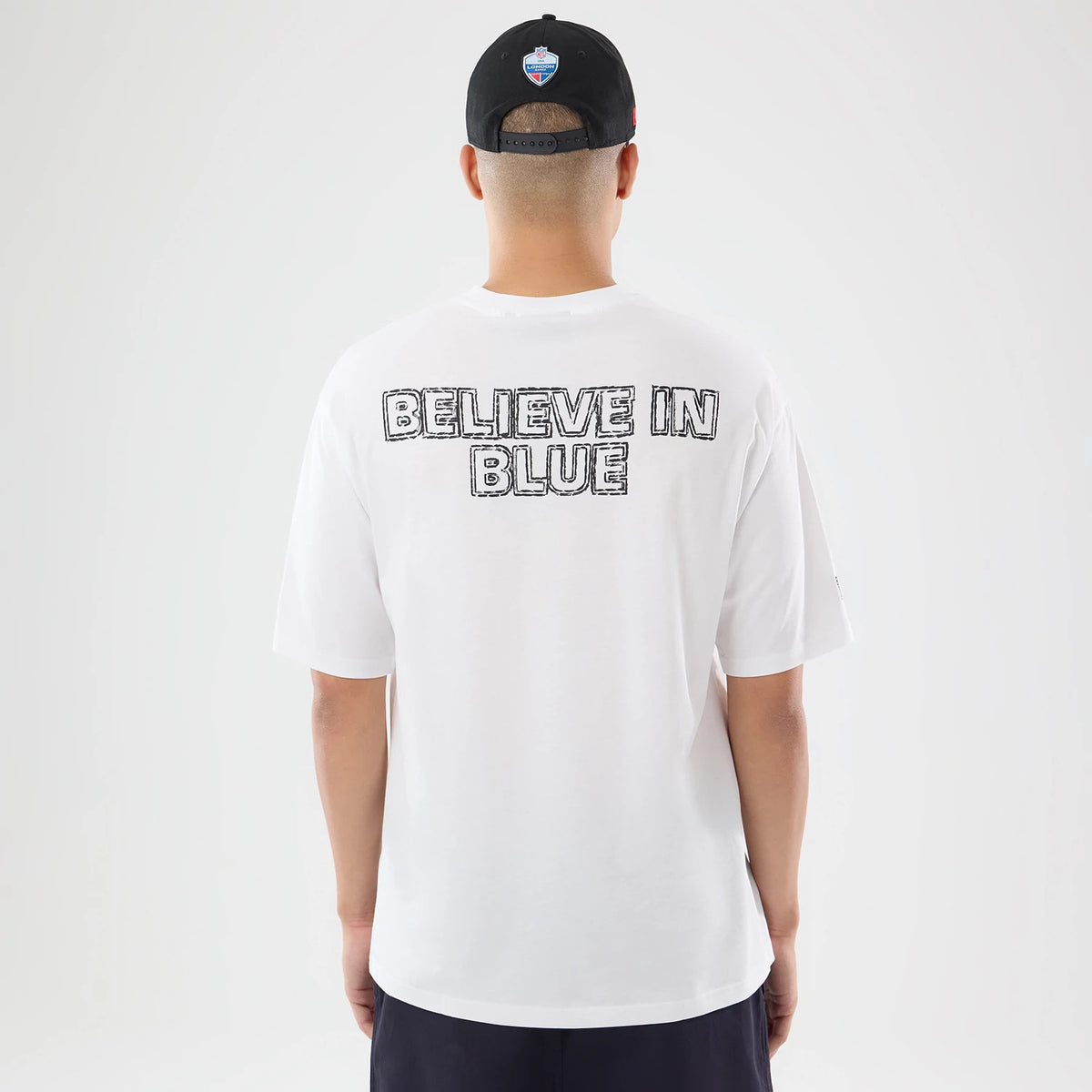The model is wearing this NFL International Games 2026 Indianapolis Colts Oversized T-Shirt in white. 2
