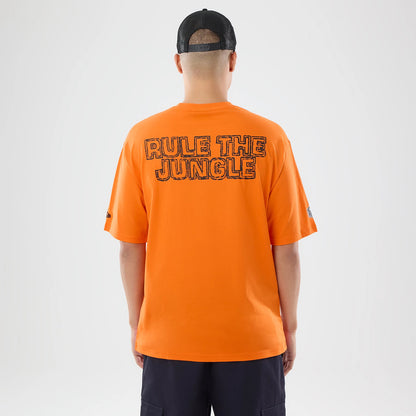 The model is wearing this NFL International Games 2026 Cincinnati Bengals Oversized T-Shirt in orange. 2