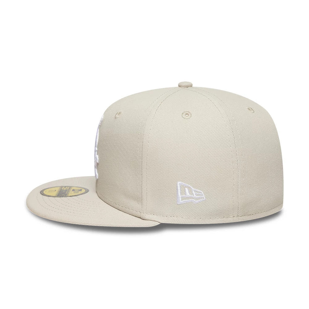Chicago White Sox MLB Beige New Era 59FIFTY Fitted Cap, side view showing the white embroidered New Era flag logo on the left side, structured beige crown with matching beige flat visor and gold 59FIFTY size sticker.