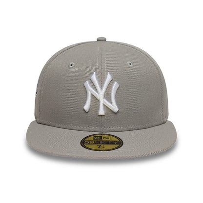 New York Yankees Essential Pack Grey & Blue New Era 59FIFTY Fitted Cap, front view showing the raised white NY logo embroidered on the grey front panel, with an attached gold 59FIFTY size sticker on the matching grey flat visor.