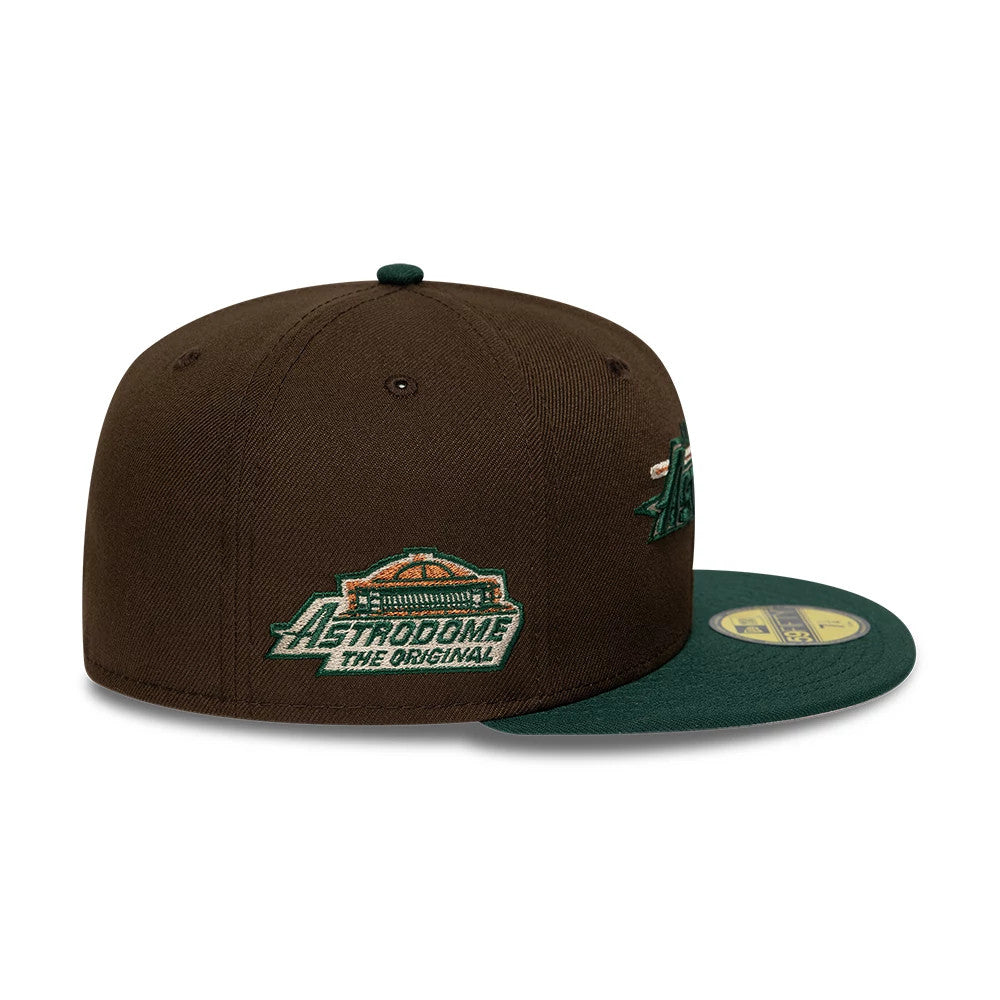 Astros MLB Cooperstown Dark Brown & Dark Green New Era 59FIFTY Fitted Cap, side view showing the Astrodome logo in green and orange embroidery on the back panel, with a structured dark brown crown.
