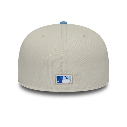 Colorado Rockies MLB Cooperstown Cream New Era 59FIFTY Fitted Cap, rear view showing the blue and white embroidered MLB Batterman logo at the centre back, set low on the structured cream crown with a light blue top button.
