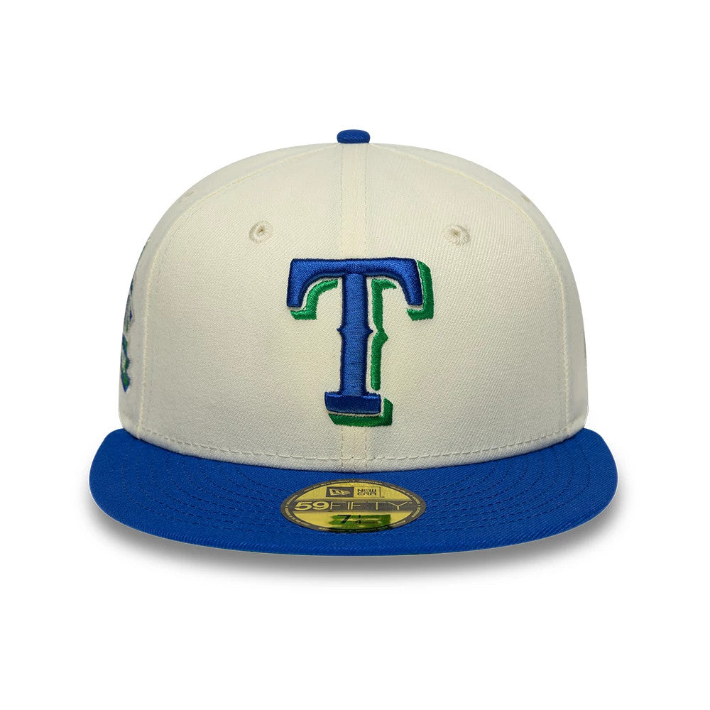 Texas Rangers MLB Cooperstown White & Blue New Era 59FIFTY Fitted Cap, front view showing the blue and green embroidered T logo on the white structured crown, with a blue flat visor and a gold 59FIFTY size sticker centred on the visor.