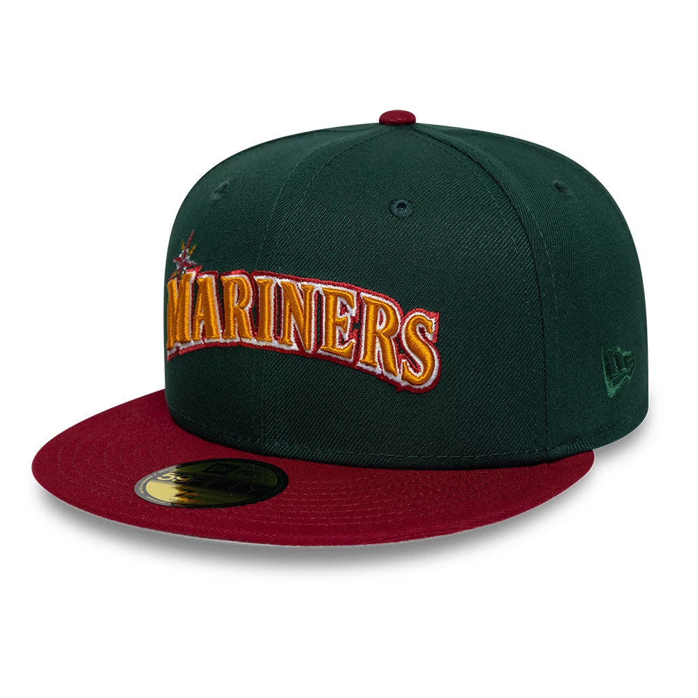 Seattle Mariners MLB Cooperstown Dark Green New Era 59FIFTY Fitted Cap, three-quarter view showing the raised embroidered Mariners lettering in yellow and white across the front panel, with a contrasting red visor.