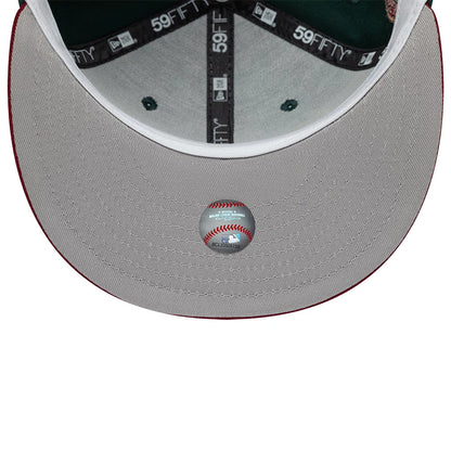 Seattle Mariners MLB Cooperstown Dark Green New Era 59FIFTY Fitted Cap, inside view showing dark grey taping with 59FIFTY logos, a green undervisor, a white sweatband, and a baseball graphic sticker placed centrally at the top of the grey visor.