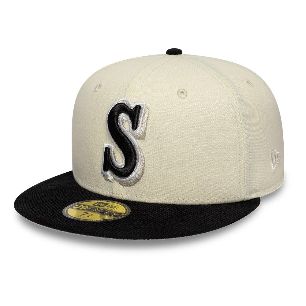 Seattle Mariners MLB Cooperstown White New Era 59FIFTY Fitted Cap, three-quarter view with a prominent black and silver embroidered S on the front panel, a contrasting black visor, and a gold 59FIFTY size sticker on the visor.
